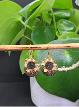 Dormeuses, soleil en laiton et cuir métallisé et noir pailleté cuivré..