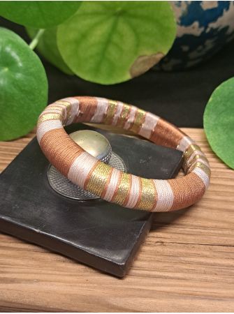 Jonc marron, beige et doré.