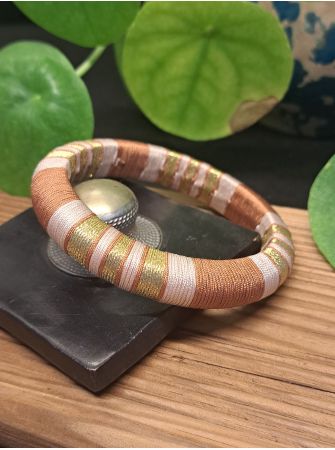 Jonc marron, beige et doré.