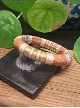 Jonc marron, beige et doré.