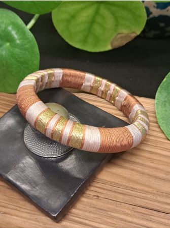 Jonc marron, beige et doré.